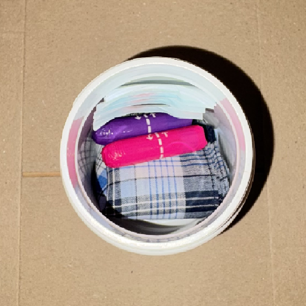Bandages, tampons, and a folded handkerchief layered inside the capsule tub.