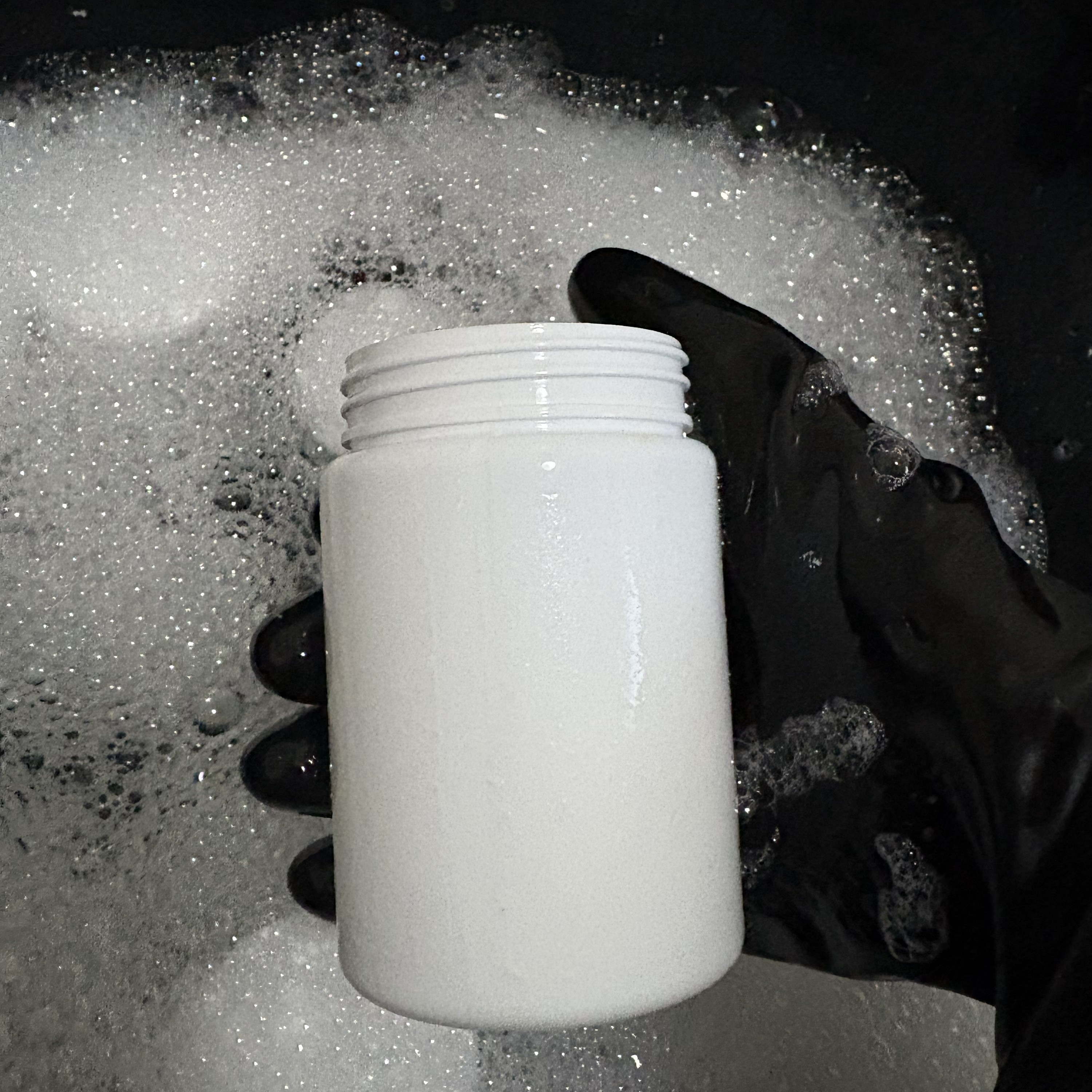 Freshly rinsed containers set aside to air dry on a clean rack.